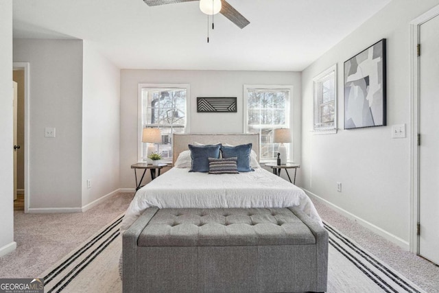 bedroom featuring baseboards, multiple windows, carpet, and ceiling fan