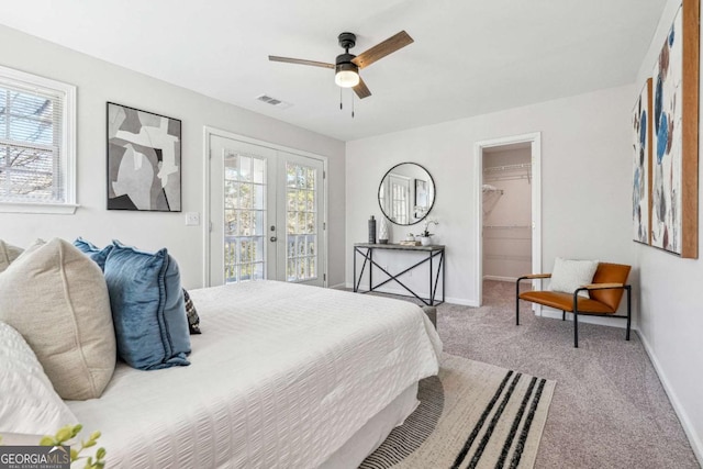 carpeted bedroom featuring visible vents, multiple windows, access to outside, and french doors