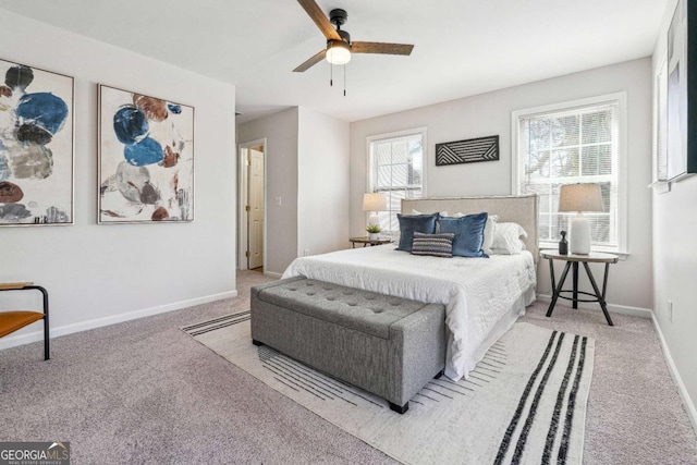 carpeted bedroom featuring baseboards and ceiling fan