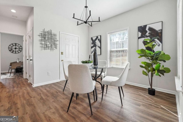 dining room featuring a chandelier, recessed lighting, baseboards, and wood finished floors