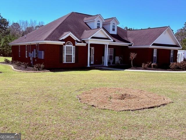 view of front of home with a front yard