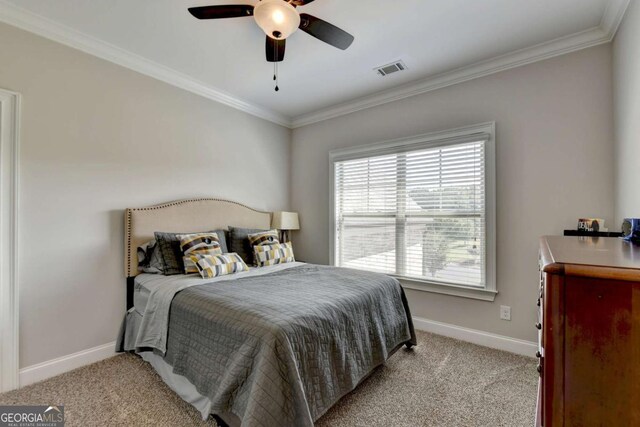 bedroom with ornamental molding, baseboards, and light carpet