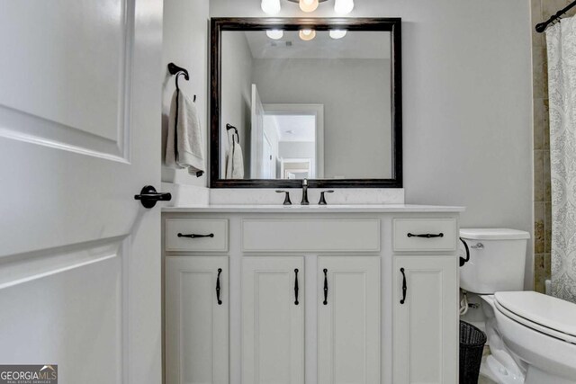 bathroom with a shower with shower curtain, toilet, and vanity