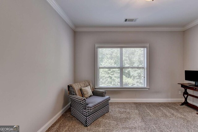 living area featuring visible vents, baseboards, carpet, and ornamental molding