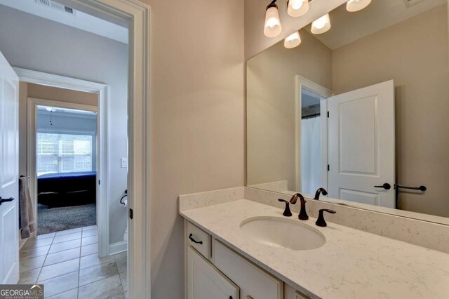 bathroom featuring tile patterned floors, visible vents, and vanity