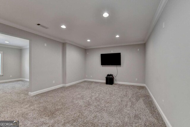 carpeted empty room with crown molding, recessed lighting, baseboards, and visible vents