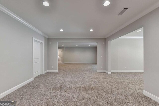 office area with crown molding, carpet flooring, baseboards, and visible vents