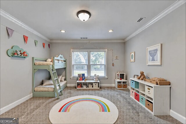 office space with visible vents, carpet flooring, baseboards, and ornamental molding