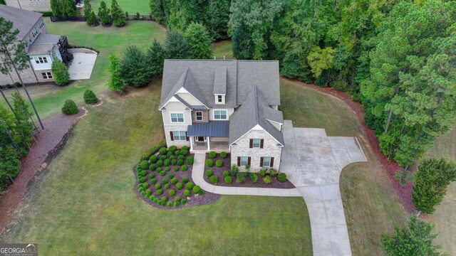 view of front of property with a garage, brick siding, and concrete driveway