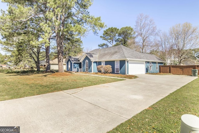 ranch-style home with an attached garage, concrete driveway, a front lawn, and fence