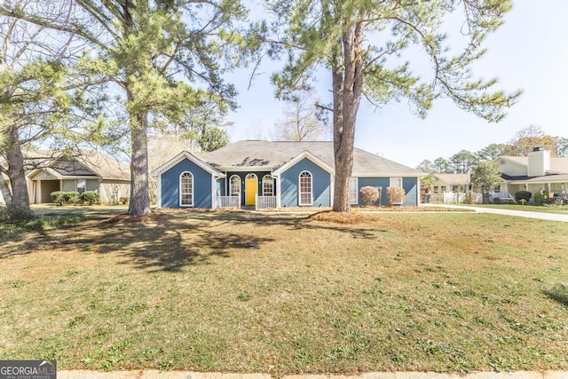 ranch-style house with a front lawn