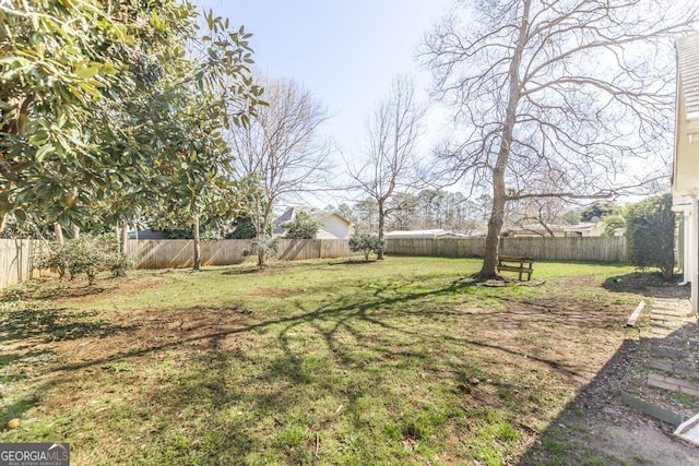 view of yard with a fenced backyard