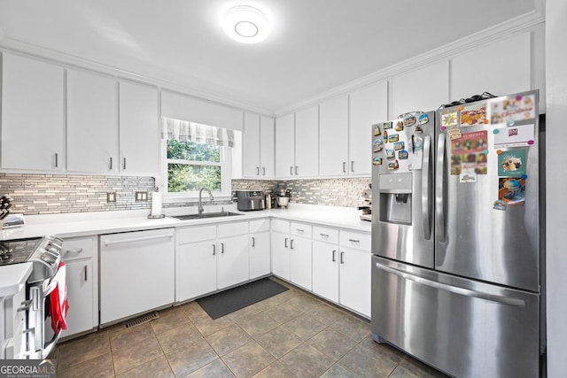 kitchen with light countertops, appliances with stainless steel finishes, and a sink