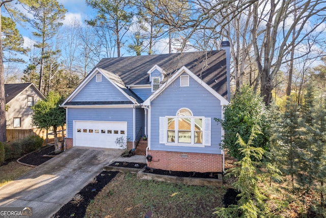 view of front of home with fence, concrete driveway, a garage, brick siding, and a chimney