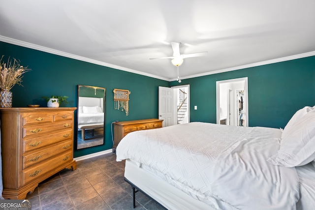 bedroom with crown molding, dark tile patterned floors, and ceiling fan