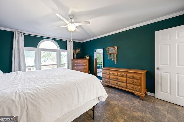 bedroom featuring crown molding and a ceiling fan