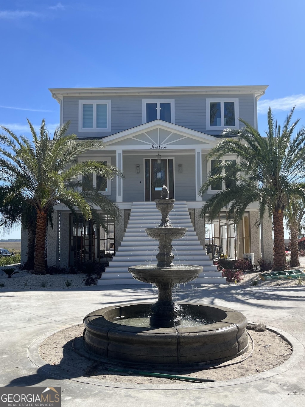 view of front facade featuring stairway