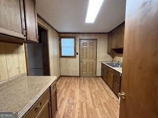 kitchen with light countertops and light wood finished floors