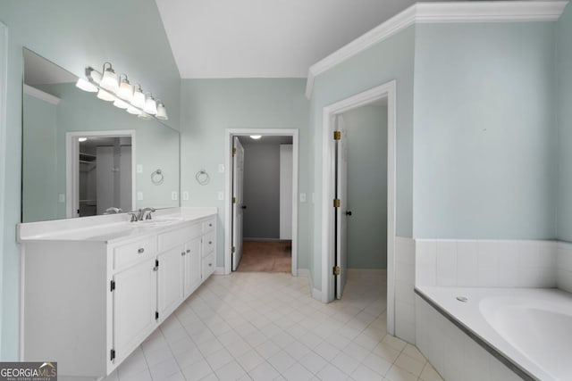 full bathroom with tile patterned floors, a tub to relax in, and vanity