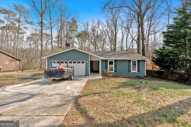 ranch-style home featuring a front lawn, concrete driveway, and a garage