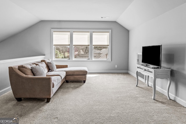 interior space with visible vents, baseboards, and vaulted ceiling