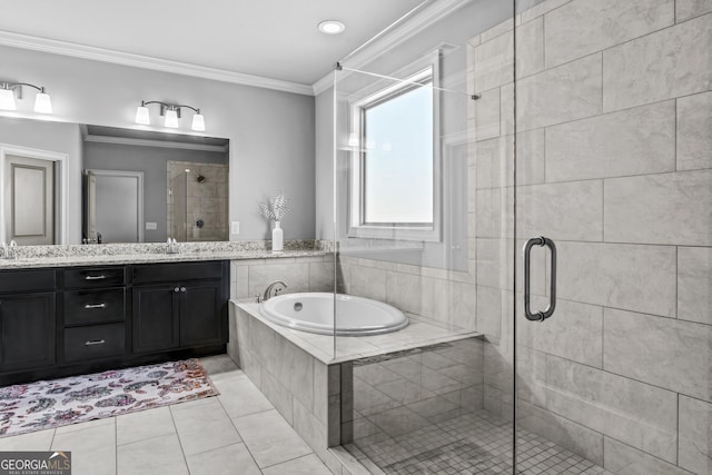 bathroom with a garden tub, double vanity, a shower stall, crown molding, and tile patterned floors