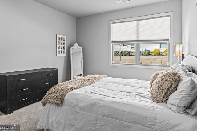 bedroom featuring visible vents and carpet floors