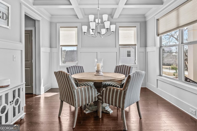 dining area featuring beam ceiling, plenty of natural light, and an inviting chandelier