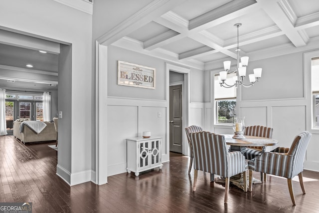 dining space featuring a wealth of natural light, beamed ceiling, a chandelier, and hardwood / wood-style flooring