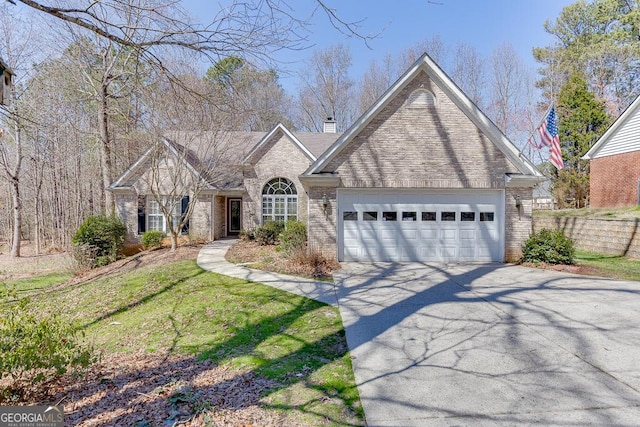 view of front facade with brick siding, an attached garage, and concrete driveway