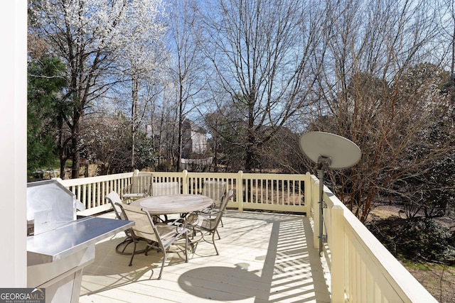 deck with outdoor dining space