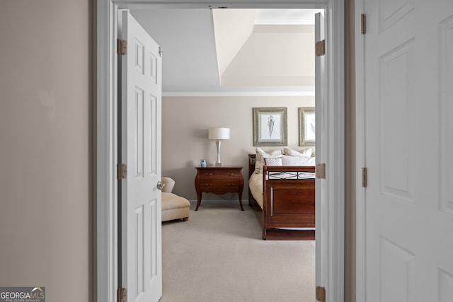 hall with light carpet and crown molding