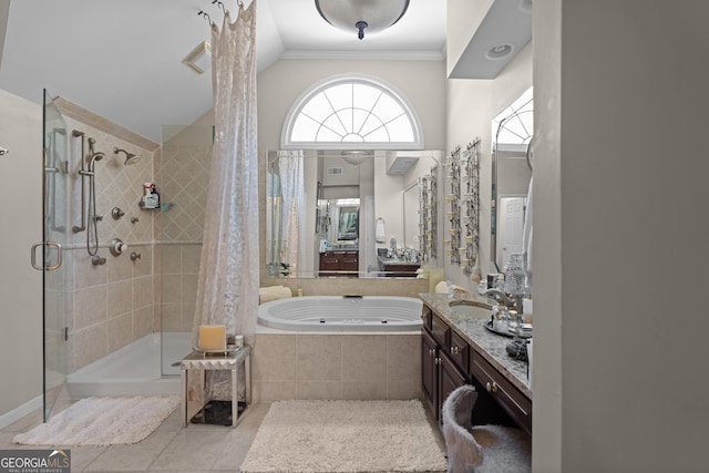 full bathroom featuring tile patterned floors, ornamental molding, a jetted tub, a shower stall, and vanity