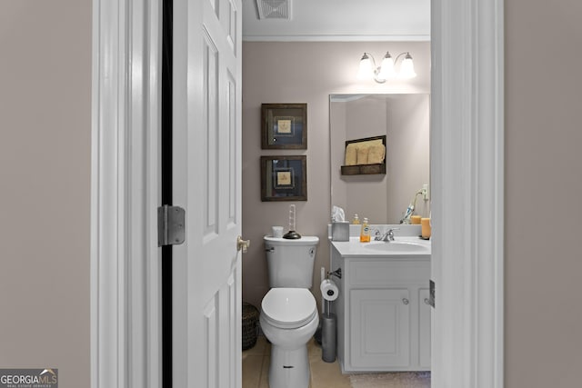 bathroom with visible vents, toilet, and vanity