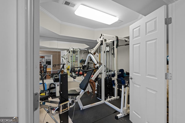 gym with visible vents and ornamental molding