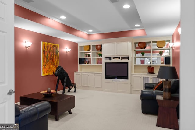 living room featuring recessed lighting, a raised ceiling, light carpet, and ornamental molding