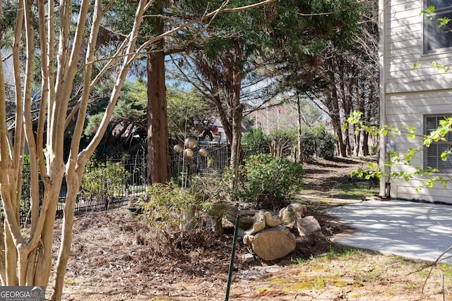 view of yard with a patio and fence