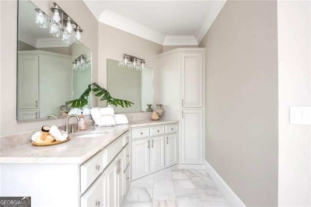 bathroom with marble finish floor, vanity, crown molding, and baseboards