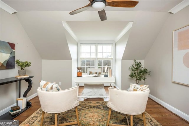 sitting room featuring baseboards, lofted ceiling, wood finished floors, and a ceiling fan