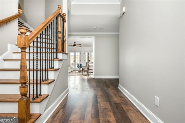 staircase featuring a ceiling fan, wood finished floors, baseboards, ornamental molding, and french doors