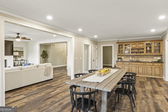714 Billings Farm Ln, Canton, GA 30115 - dining area with crown molding, dark wood finished floors, recessed lighting, baseboards, and bar with sink