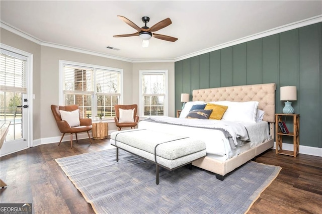 bedroom with multiple windows, wood finished floors, visible vents, and ornamental molding