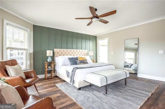 bedroom with multiple windows and crown molding