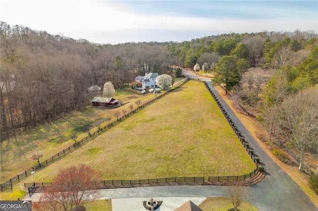 birds eye view of property with a rural view and a forest view