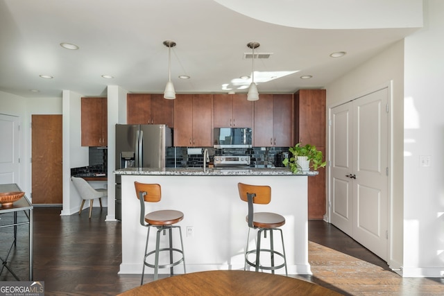 860 Peachtree St Unit 1418, Atlanta, GA 30308 - kitchen featuring a sink, backsplash, stainless steel appliances, and a breakfast bar area