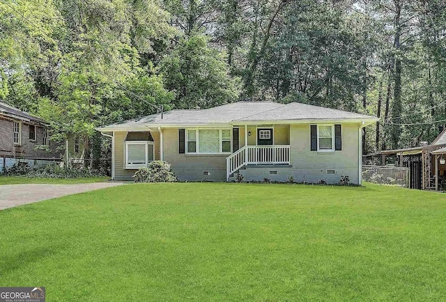 view of front of house with crawl space, a front lawn, and fence