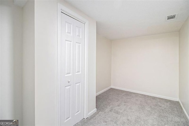 interior space featuring baseboards and visible vents