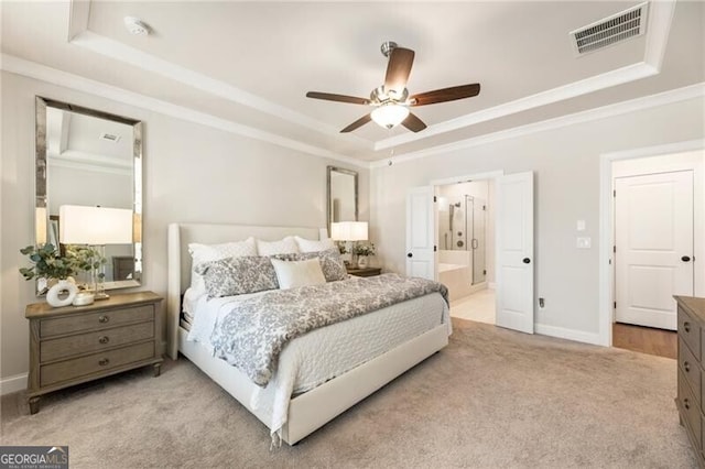 bedroom featuring carpet, baseboards, visible vents, ornamental molding, and a raised ceiling