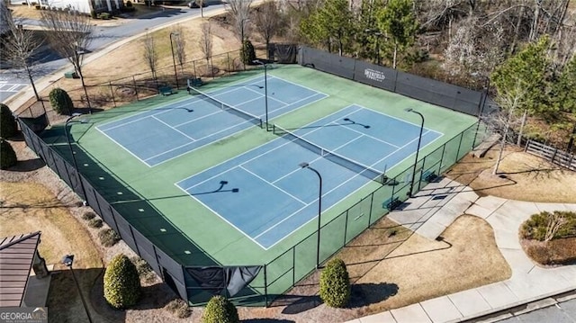 view of sport court with fence