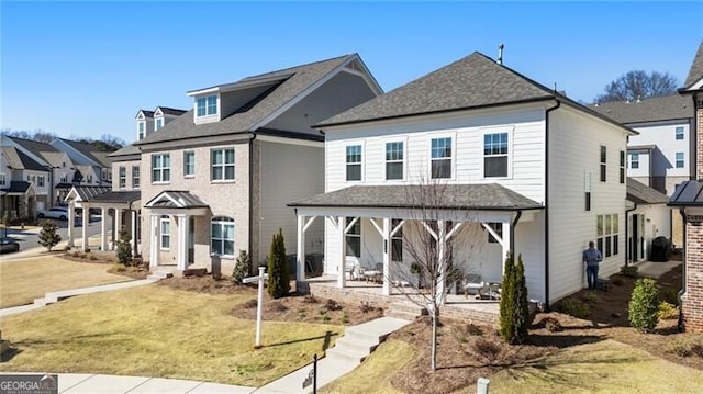 view of front facade with a front yard and a residential view